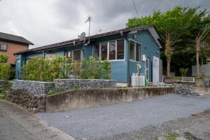 a blue house on the side of a street at The Whale House 日光 by Silver Daisy in Nikko