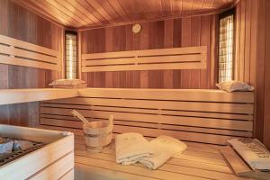 a sauna with wooden walls and wooden floors and towels at Villa Vinita w/ Jacuzzi & Sauna near Thermal Spa - Happy Rentals in Sveti Jurij ob Ščavnici