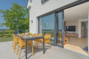 a dining room with a table and chairs at Villa Vinita w/ Jacuzzi & Sauna near Thermal Spa - Happy Rentals in Sveti Jurij ob Ščavnici