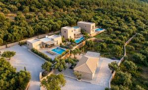 an aerial view of a house with a swimming pool at Riverstone Villas with private pools in Lévktron