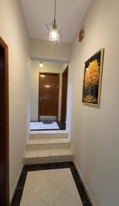 a hallway with a painting on the wall at ضيوف الخريف in Salalah