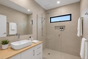 a bathroom with a sink and a shower at Mercer on Port in Portarlington +5 photos