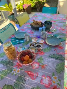 a table with a table cloth with food on it at Villa Caplanne in Sanguinet