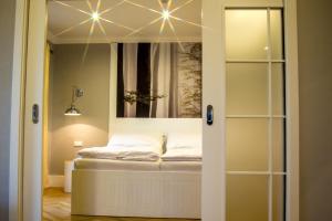 Postel nebo postele na pokoji v ubytování Spa Hotel Garni Löwenstein