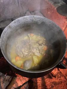a pot of soup on top of a stove at EeeLSii Health Rest in Manzini