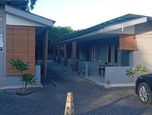 a car parked in front of a building at Langkawi-Village Mix Dormitory in Pantai Cenang