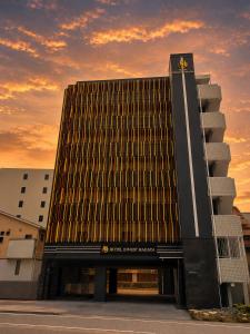 a large building with a sunset in the background at INNEST Hakata in Fukuoka