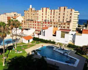 an overhead view of a large building with a swimming pool at Brisa de Torre in Torre del Mar