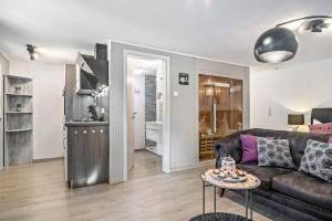 a living room with a couch and a table at Eifel-Dream Kalkmulde in Fleringen
