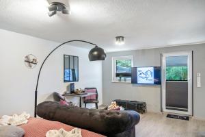 a living room with a couch and a table at Eifel-Dream Kalkmulde in Fleringen