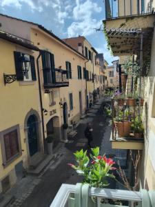 a man walking down a street in an alley at Tata in Castel Gandolfo