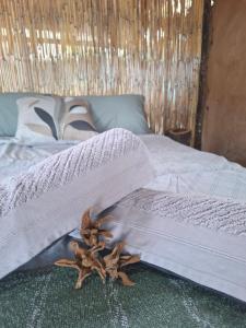 a bed with a blanket on top of it at Hennies HideOut in Kachikau +7 photos