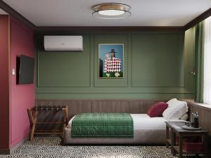 a bedroom with a bed and a picture of a man at Botel Albatros in Prague
