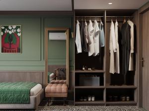 a room with a closet with a bed and clothes at Botel Albatros in Prague