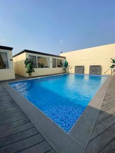 a swimming pool on the roof of a house at Cafe Itaewon Pool & Villa in Sampong