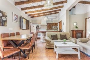 a living room with a table and a couch at Casa Villazo 1 in Málaga