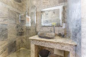 a bathroom with a sink and a shower at La Bastide Des Mereuilles in Orange +37 photos