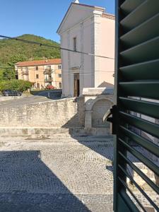 a building with a gate in front of a street at Casa Bea in Castiglione