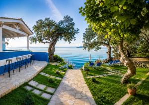a view of the water from the backyard of a house at Lido Corfu Sun Hotel 4 Stars All-inclusive in Benitses
