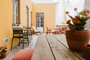 a wooden table with a potted plant on top of it at Villa Galega in Santa Cruz +159 photos
