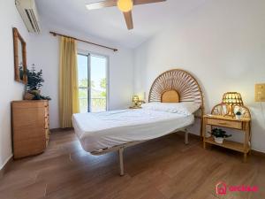 a bedroom with a large bed and a window at House Bloom in Oropesa del Mar