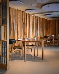 a dining room with a wooden table and chairs at The Angel at Hetton in Hetton