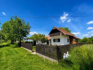 a house with a fence in front of it at Takovo Hills in Vrnčani