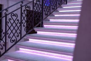 a flight of stairs with lights on them at Relais V&G in Anagni