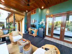 a room with a patio with a bed and a living room at Beachview Villa near Sanur, Live Sports AFL NRL in Ketewel +72 photos