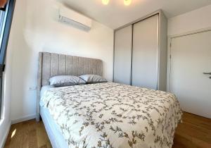 a bedroom with a large bed in a room at 1bd New and Modern Apt with Sea View "Blue Horizon" in Bar