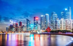 a view of a city skyline at night at Crowne Plaza Qingdao by IHG in Qingdao