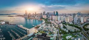 an aerial view of a city with a harbor at Crowne Plaza Qingdao by IHG in Qingdao