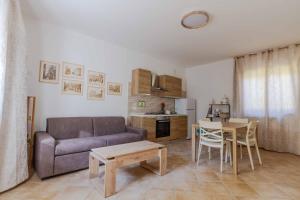 a living room with a couch and a table at La Ruetta in LʼAquila