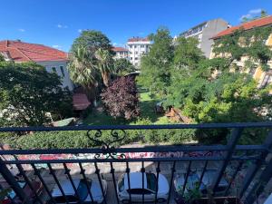 a balcony with a view of a park and buildings at Vicolo Moda Kadıköy in Istanbul