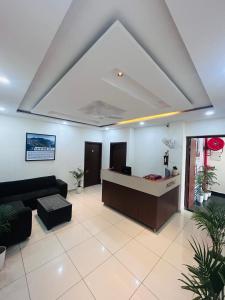 a lobby with a reception desk in a building at hotel capetown in Sirsa