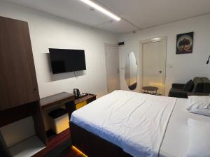 a hotel room with a bed and a television at Vicolo Moda Kadıköy in Istanbul +20 photos