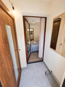 a hallway with a door leading to a bedroom at Apartment Alee in Lesce