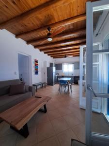 a living room with a couch and a table at Hotel Posidonion in Koufonisia