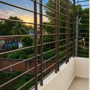 a view from the balcony of a building with large windows at Jannat Residential Hotel in Atgaon