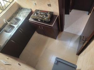 an overhead view of a bathroom with a sink and a toilet at The Oasis in Ilorin