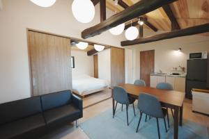 a kitchen and dining room with a table and chairs at 日和のすみか in Ichihara