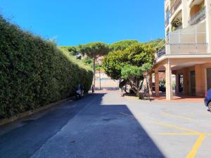 a street in front of a building at Casa Patrik in Pietra Ligure