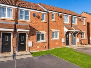 a brick house with a driveway in front of it at 2BR House By Cozy Quarters Property Management Contractors Accommodation Spennymoor With Parking in Spennymoor