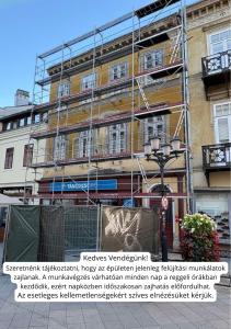a building under construction with scaffolding on it at 8 - Il Becco Rosato - DonViore in Győr