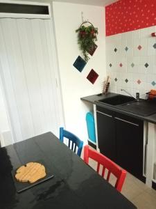 a kitchen with a table with cookies on it at Les Jeux du Moulin in Nouans-les-Fontaines