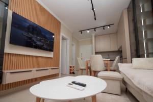 a living room with a couch and a table at Golem Escape in Kavajë