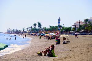 a beach with a lot of people on it at Brisa de Torre in Torre del Mar