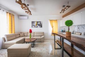 a living room with a couch and a table at Villa Enigma in Gevgelija