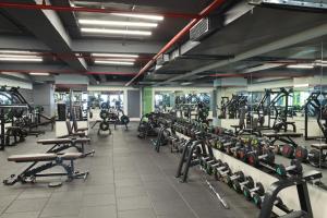 a large gym with rows of treadms and machines at Ginger Ahmedabad RTO Circle in Ahmedabad