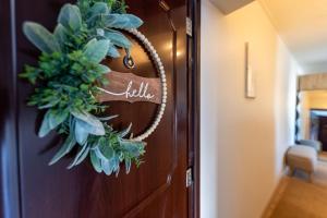 a christmas wreath on a door in a hallway at Marie` Apartment in Salme